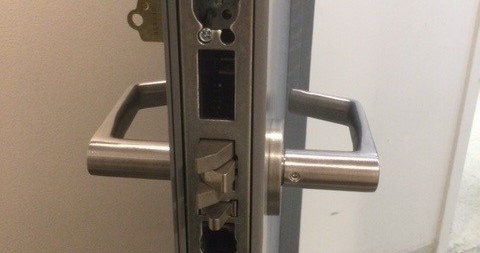 Commercial door lock opened up for urgent repair