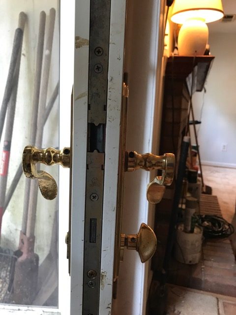 Door edge opened to show the full-height multipoint lock strip and interior handles